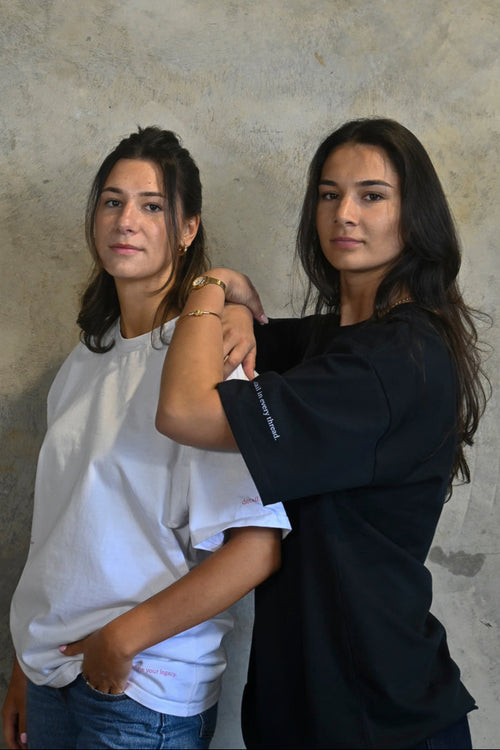 Female models styling white and pink oversized streetwear tee from Thirty Four Thirty Four