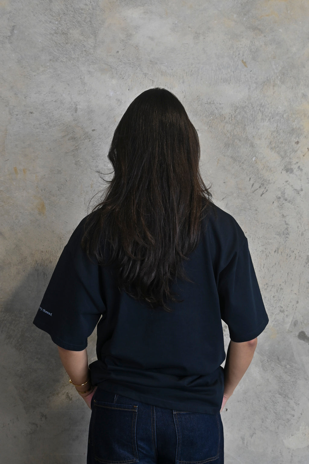 Back view of oversized heavy cotton t-shirt in deep midnight navy