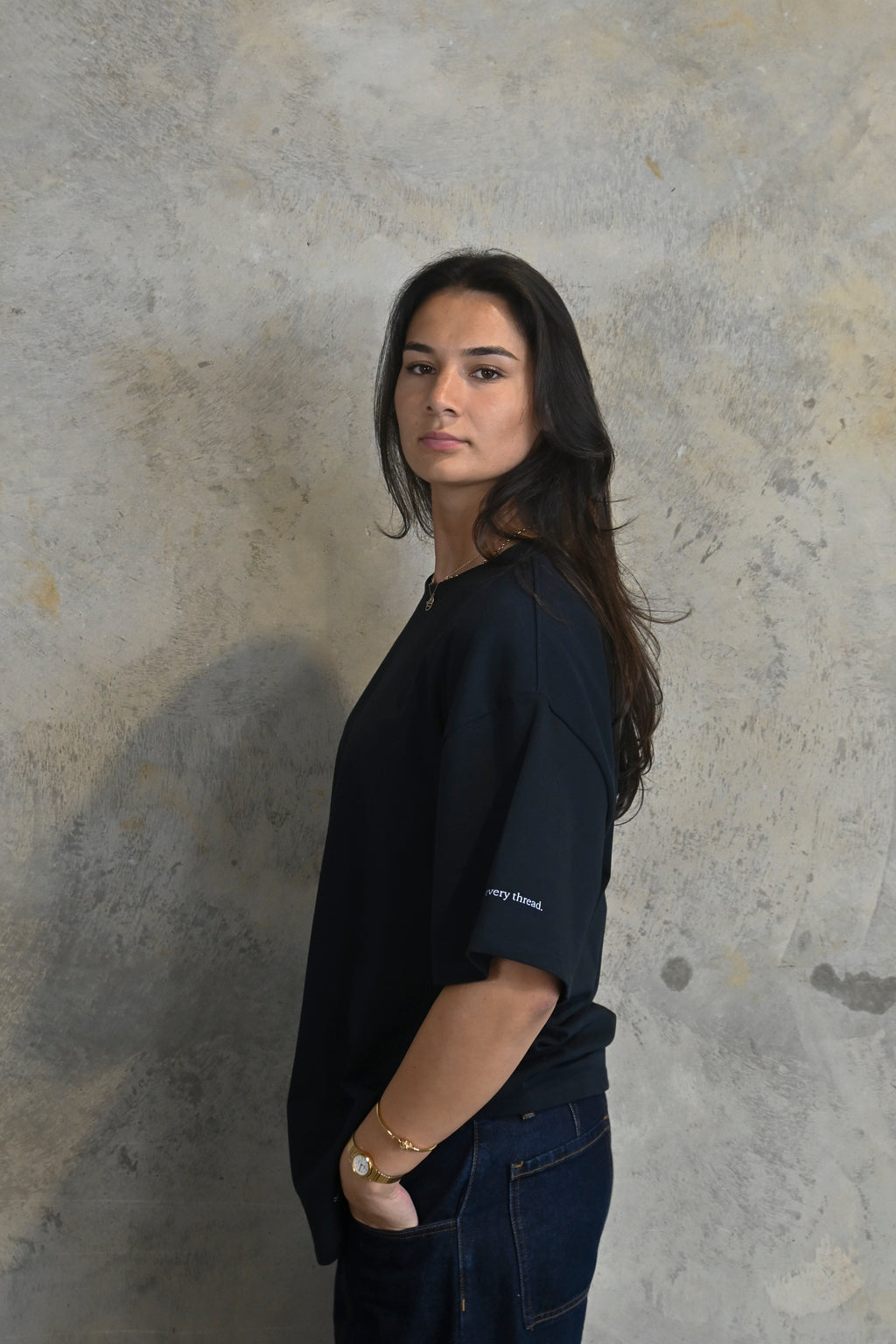 Right sleeve print reading detail in every thread on dark navy tee