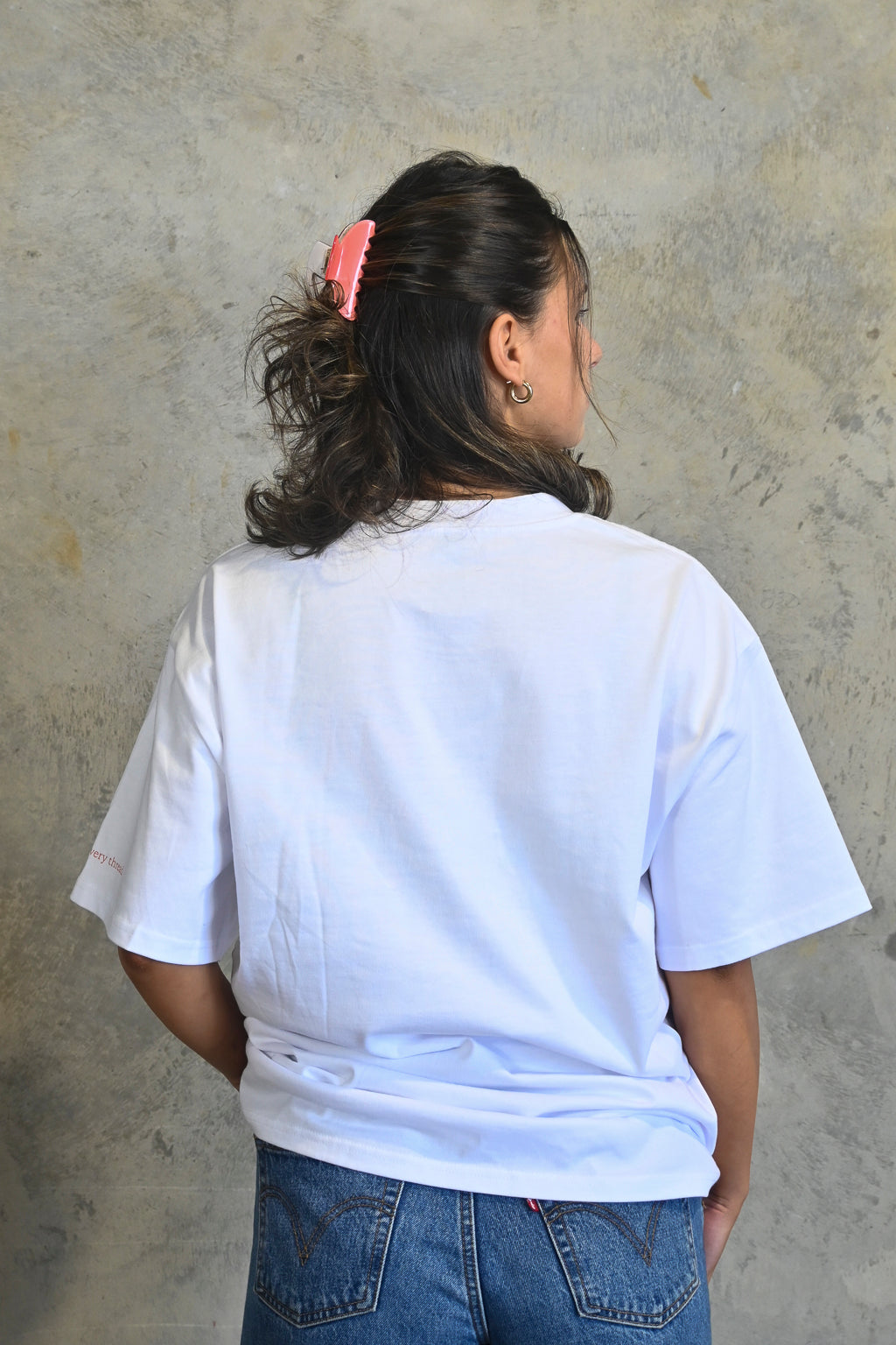 Back view of oversized white streetwear tee made from heavyweight cotton